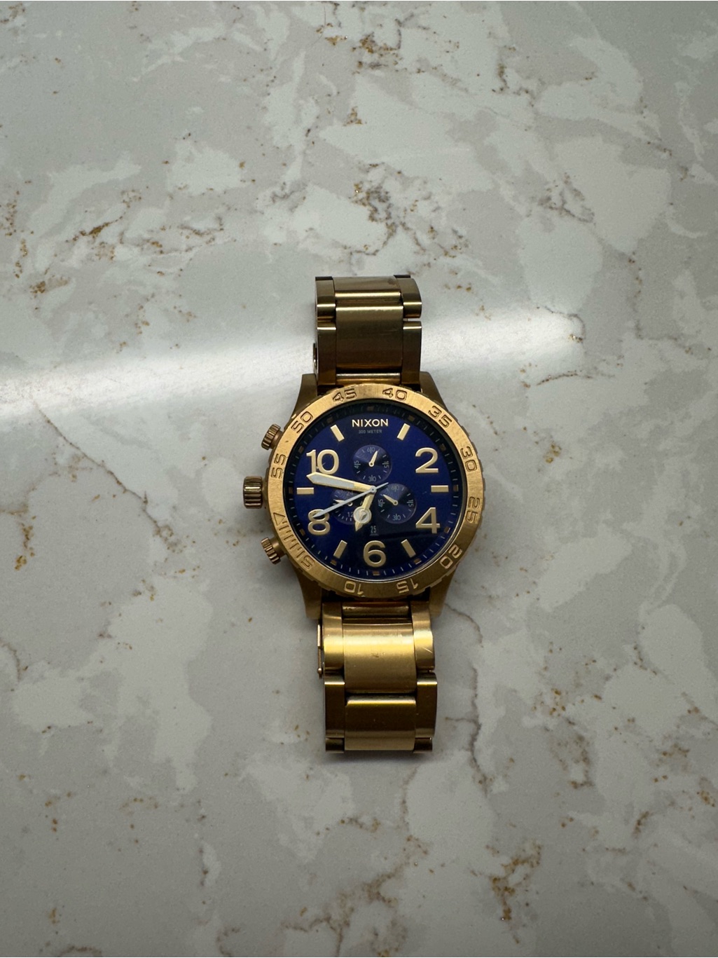 Nixon Gold-Tone Bracelet Watch With Blue Dial